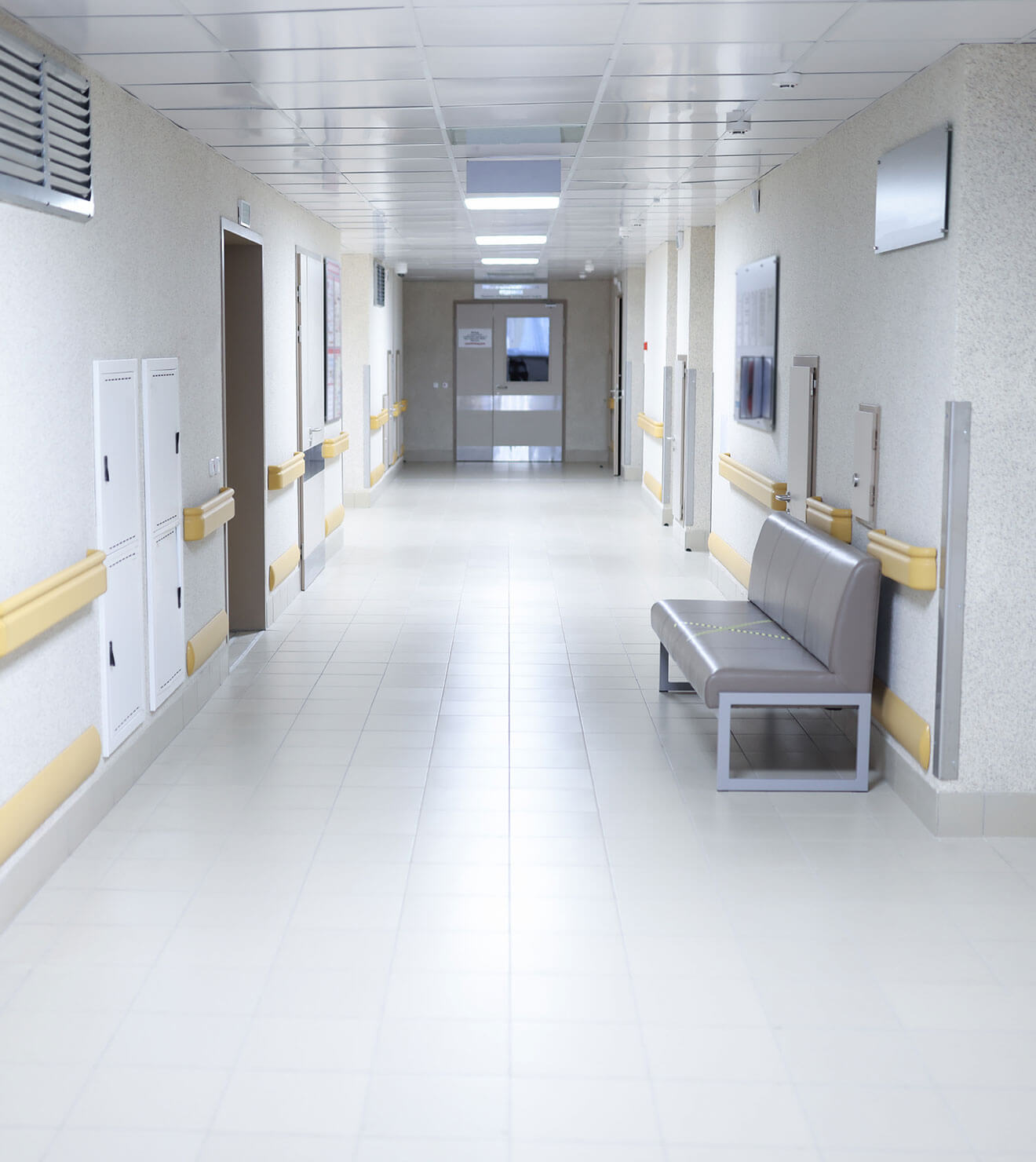 Hospital corridor and patient rooms with clean floors maintained with Powerit's floor cleaner