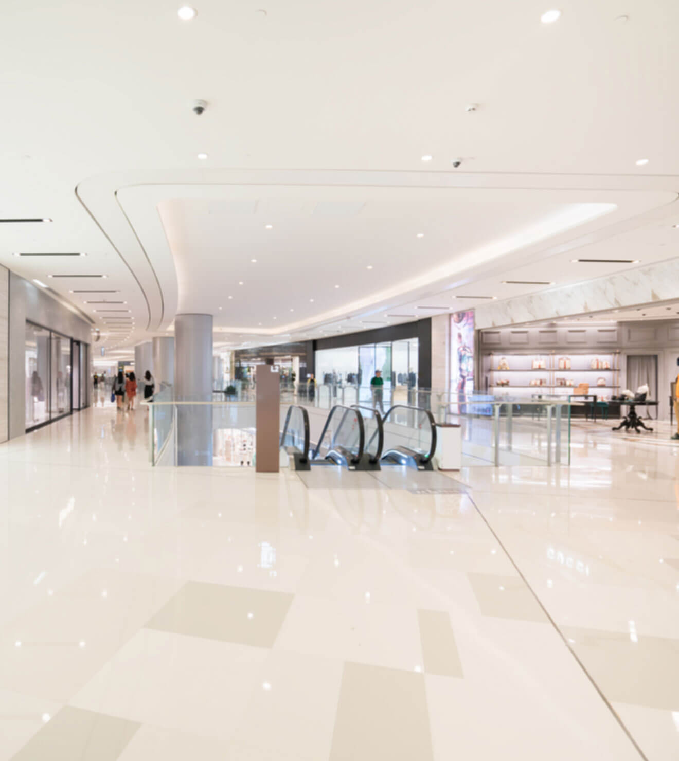 Spacious mall corridor with shining floors treated by Powerit commercial cleaning solution